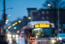 Walking home late at night, he held two infants close, a grocery bag swinging from one arm and a worn toolbox in the other, after their mother had abandoned them.