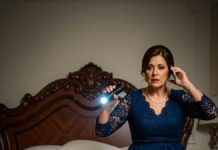 During our wedding night, I slipped under the bed to play a joke on my husband—only for the bedroom door to open and a stranger’s voice come through a phone on loudspeaker.