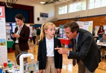 They laughed at my daughter’s project, whispering that she was “the dumb kid of the divorcee.” The judges dismissed her without a glance—until a stranger stopped, stared, and said, “This invention deserves a patent.” Everything changed in that moment.